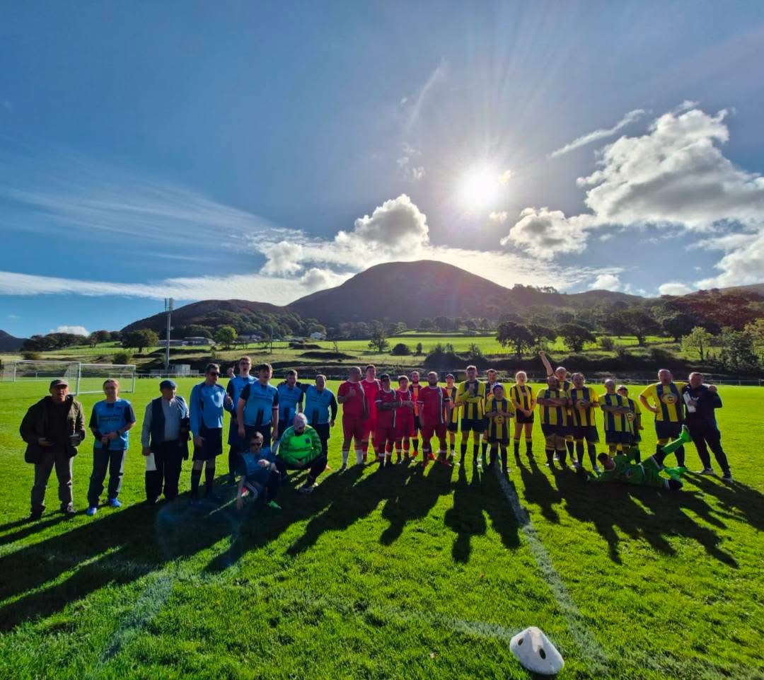 Players and supporters from the All Stars round robin together on the Cae Sling pitch