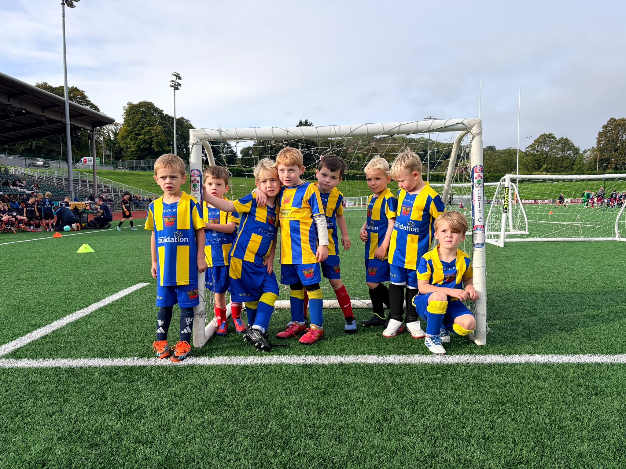 Phoenix U6 boys together in front of a small goal